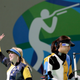 Virginia Thrasher, left, of the United States waves after she won the gold medal for the Women's 10m Air Rifle competition ash runner up Du li, right, of China walks way from the shooting position at Olympic Shooting Center at the 2016 Summer Olympics in Rio de Janeiro, Brazil, Saturday, Aug. 6, 2016.